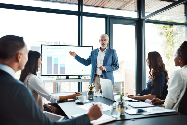 Diverse group in a business meeting looking at data